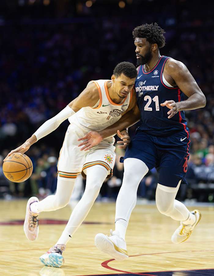 Jan 22, 2024; Philadelphia, Pennsylvania, USA; San Antonio Spurs center Victor Wembanyama (1) dribbles the ball against Philadelphia 76ers center Joel Embiid (21) during the third quarter at Wells Fargo Center.